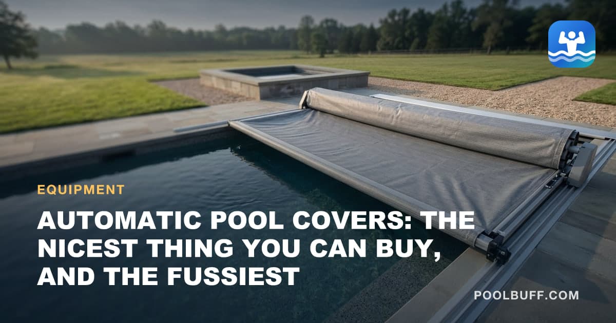 An automatic pool cover half-retracted across a rectangular pool
