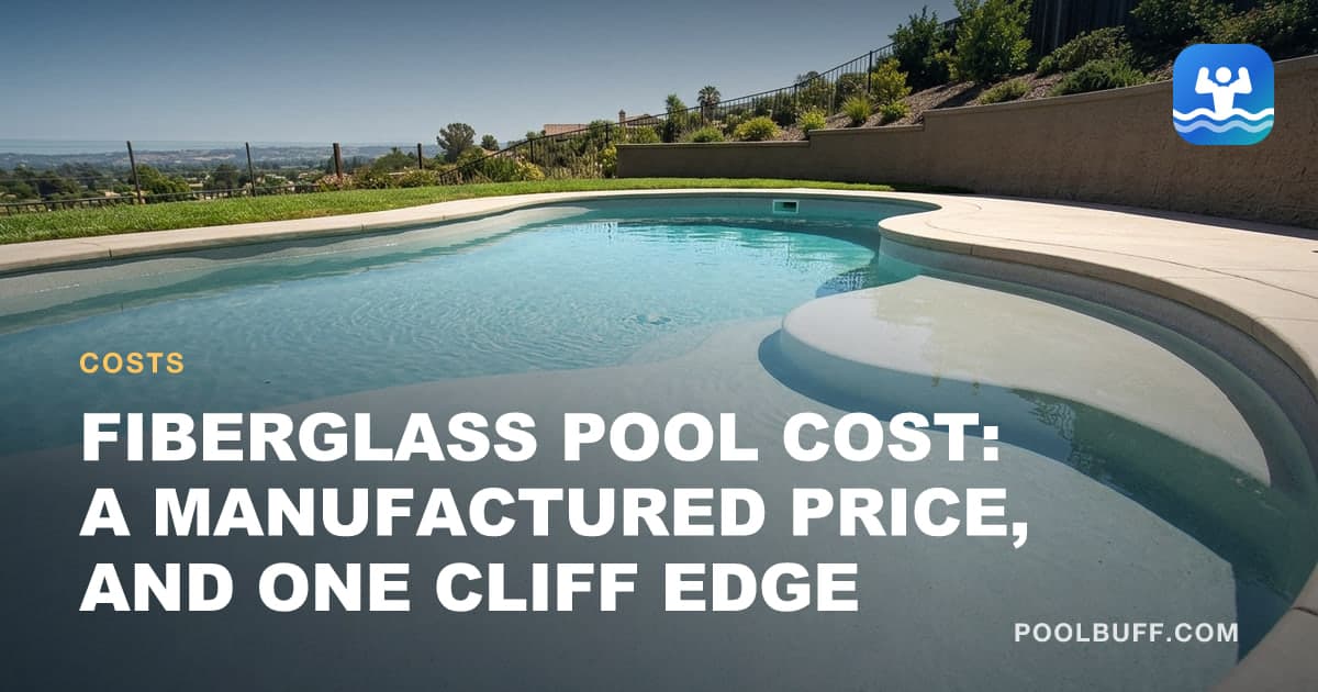 A smooth fiberglass pool shell installed and filled, sunlight on the gelcoat