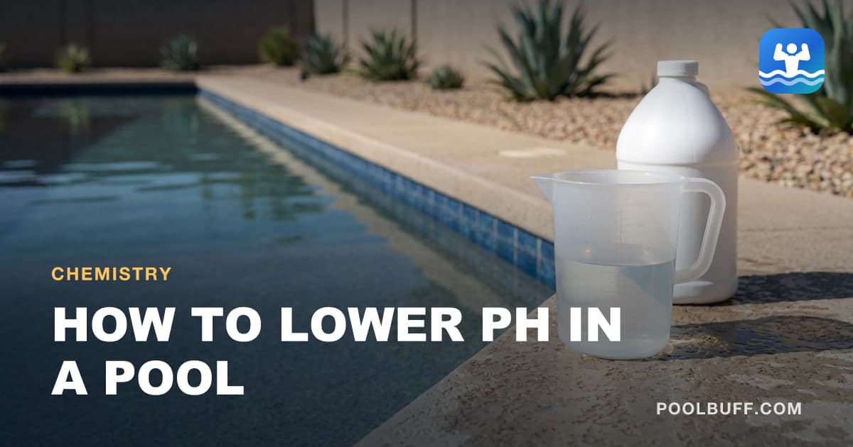 A graduated measuring jug of clear liquid and a white chemical jug standing on pool coping, desert planting and a stucco wall behind