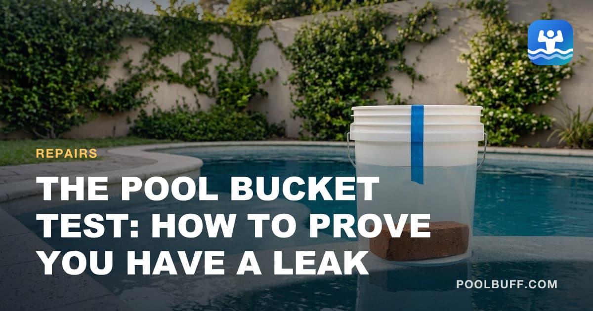 A white bucket weighted with a brick standing in shallow water on a pool tanning ledge, a strip of blue tape marking the water level on its side