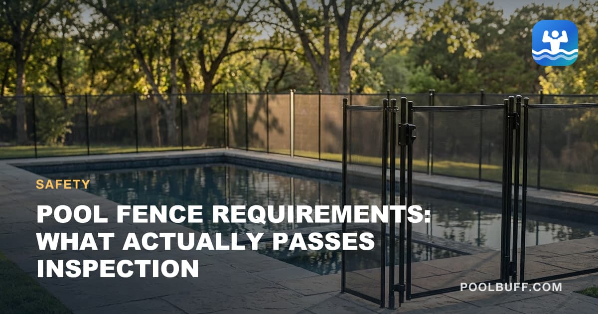 A tall mesh pool safety fence with a self-closing gate around a pool