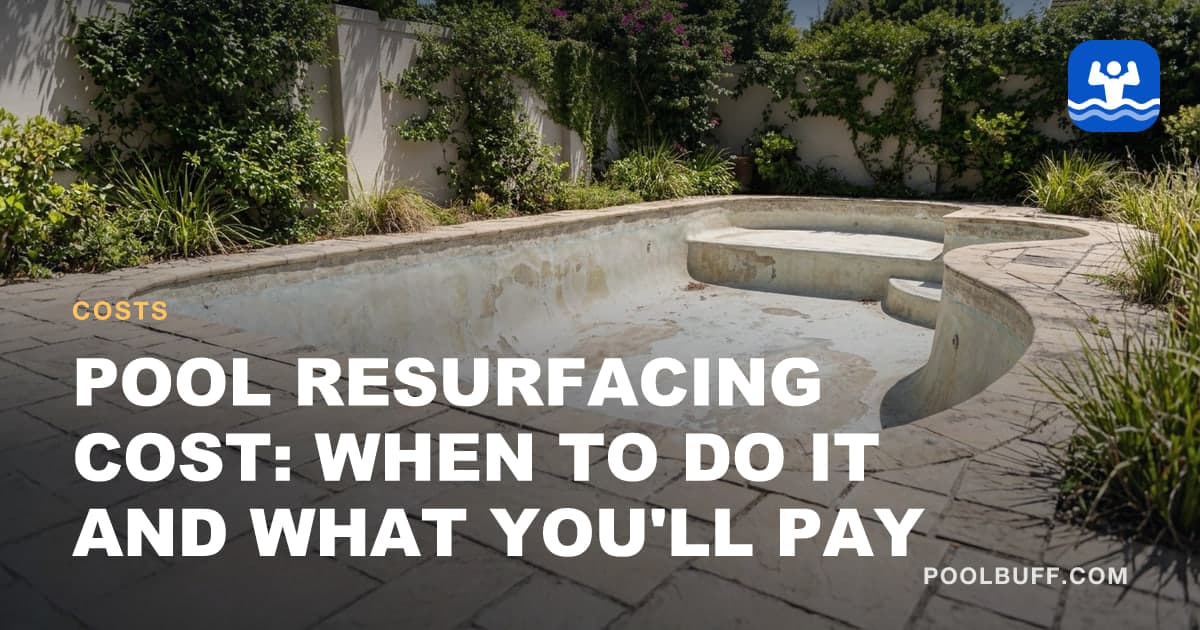 A drained pool with worn, patchy plaster awaiting resurfacing