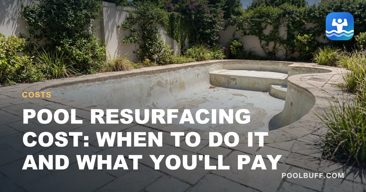 A drained pool with worn, patchy plaster awaiting resurfacing