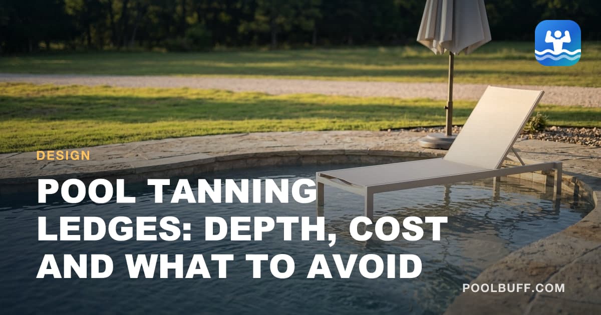 A pale lounger standing in a few inches of water on a pool shelf, a folded umbrella and rough stone coping behind it, lawn and treeline beyond